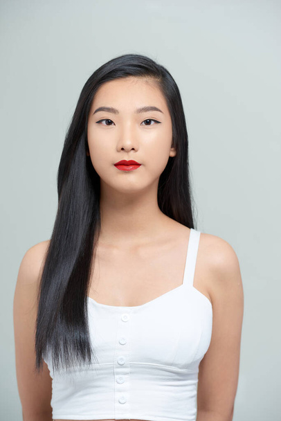 portrait of a beautiful asian girl with a serious face - Φωτογραφία, εικόνα