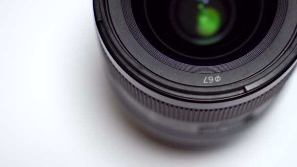 Close-up of digital camera lens on white background. - Footage, Video
