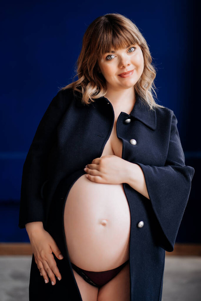 Topless pregnant with overweight in a blue jacket. - Foto, Imagem