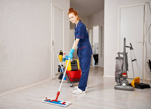 Maid woman with mop. House cleaning service concept. - Photo, Image