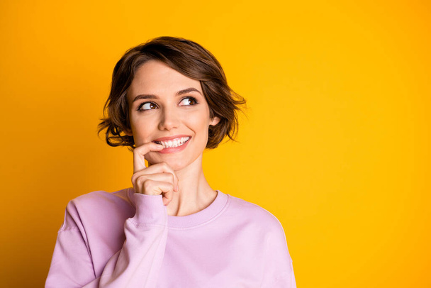Portrait of positive cute sweet teen girl touch her teeth finger think thoughts about her perfect autumn holidays wear pastel jumper isolated over bright color background - Valokuva, kuva