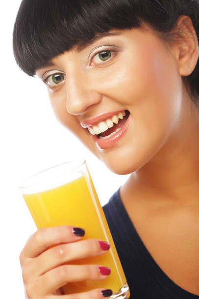 Young happy woman drinking orange juice - Photo, image