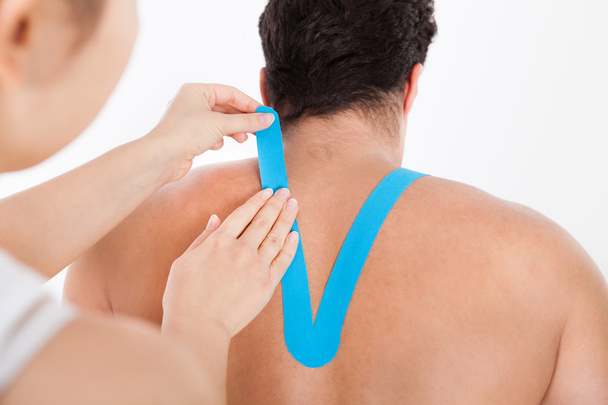 Applying Special Physio Tape On Man's Back - Photo, Image