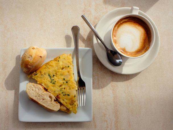 Spanish tortilla lid and coffee from above - Photo, image