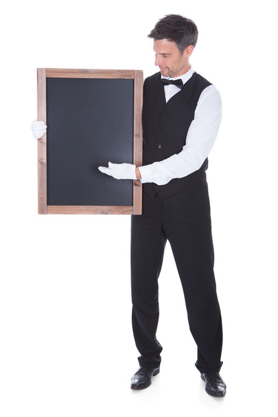 Waiter Holding Chalkboard - Foto, Imagen