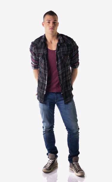 Full body shot of attractive young man with checkered shirt - Foto, Bild