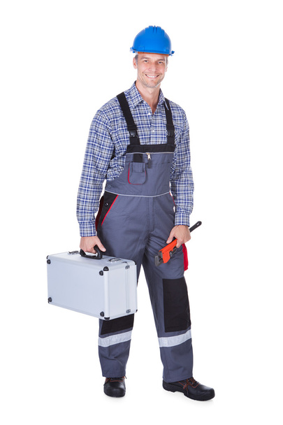 Trabalhador masculino com kit de ferramentas
 - Foto, Imagem