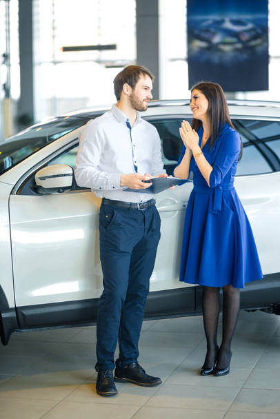 Begging. Please. Young woman praying her husband to buy her a new car - Foto, imagen