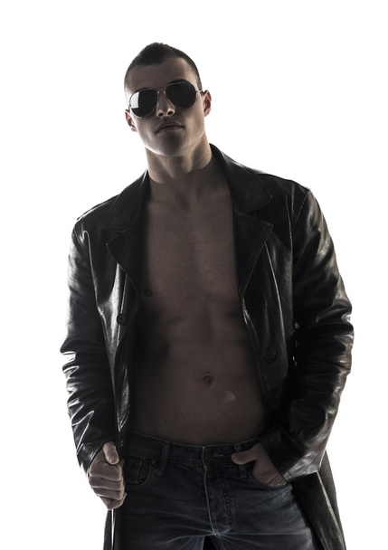 Muscular shirtless young man with leather jacket and sunglasses - Fotografie, Obrázek