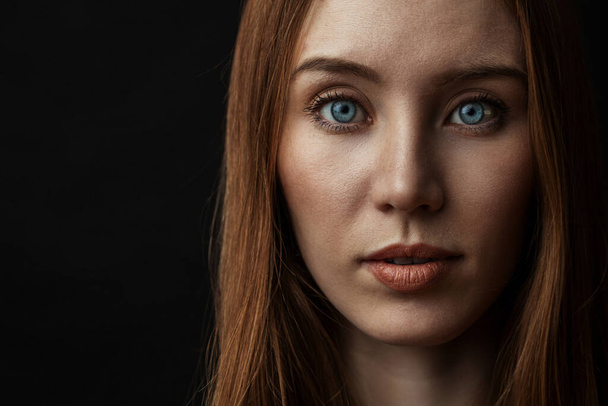 Tender young woman with beautiful eyes and long loose ginger hai - Fotoğraf, Görsel
