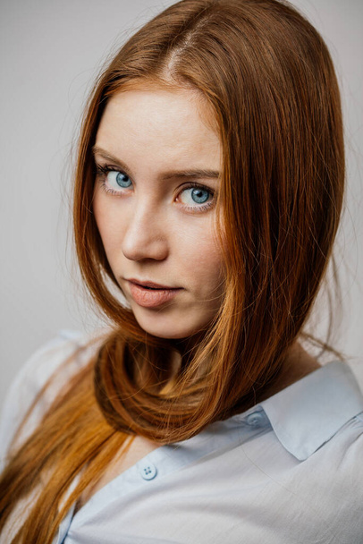 Beautiful model female with thick ginger straight long hair - Фото, зображення