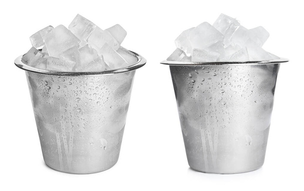 Metal buckets with ice cubes on white background  - Foto, Bild