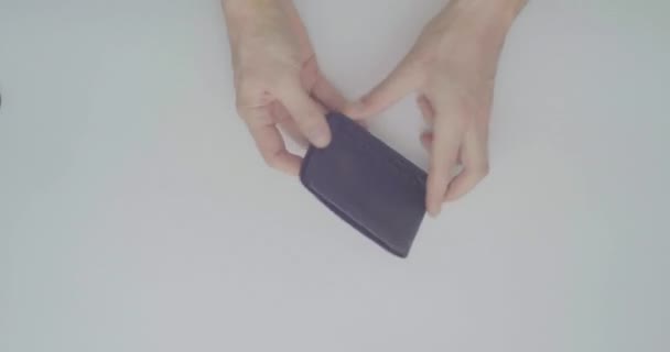 Man's Hands Holding a Empty Leather Wallet  on a White Background Table - Záběry, video