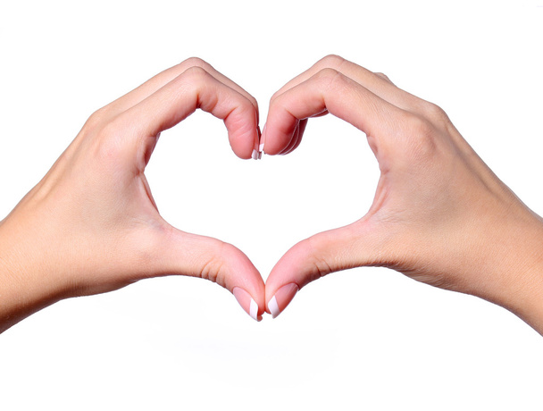 Female hands making a heart shape isolated on white background - Photo, image
