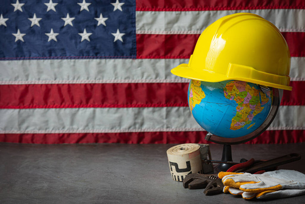 American flag and tools near the helmet Labor day concept. - Foto, Imagen