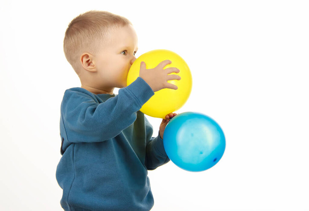 little boy child holding balloons, happy childhood. soft focus. - Foto, immagini
