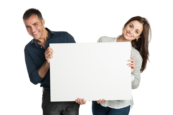 Satisfied Couple Holding A Placard - Fotografie, Obrázek