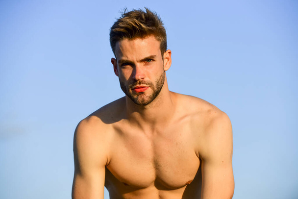 Fashion guy. Attractive and mysterious. Athletic handsome macho. Muscular body. Muscular chest. Muscular bare torso. Summer season. Fitness model. Sexy pensive man relaxing outdoors. Male beauty - Foto, imagen