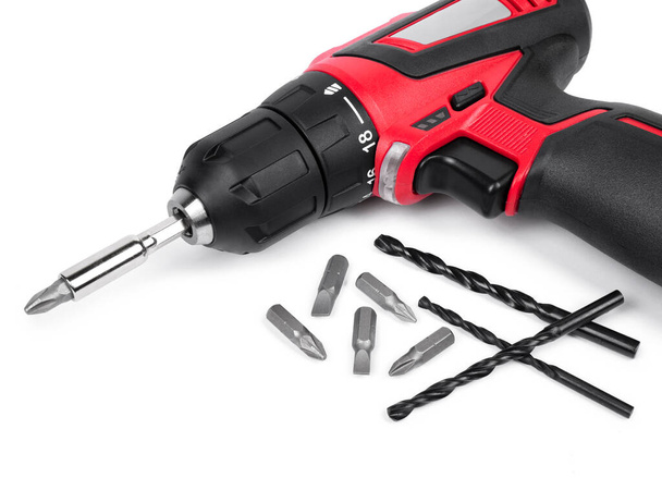 Cordless electric screwdriver with drill bit set on white background - Photo, Image