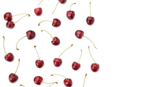 whole ripe red juicy sweet cherries isolated on a white background, top view, flat lay, copy space - Photo, Image
