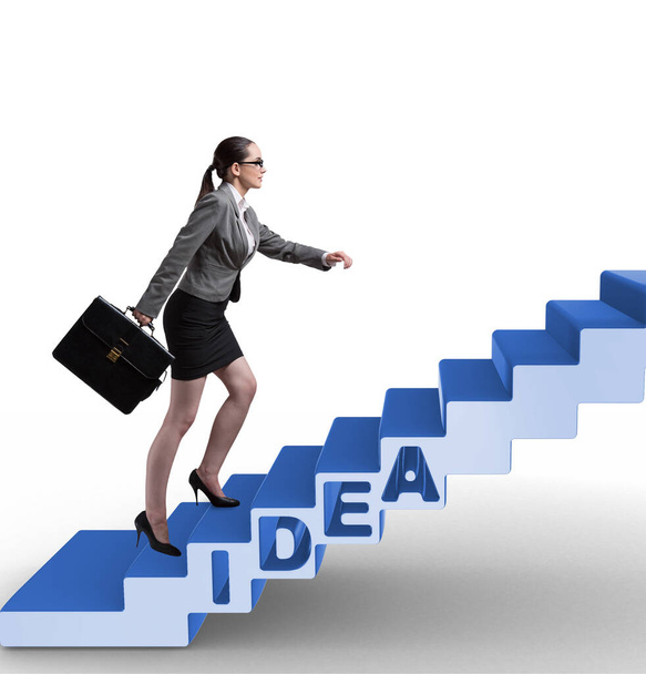 Concept van idee met zakenvrouw die trappen beklimt - Foto, afbeelding