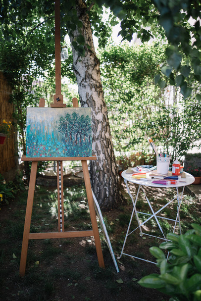 Outdoor artists atelier with plants and trees - 写真・画像