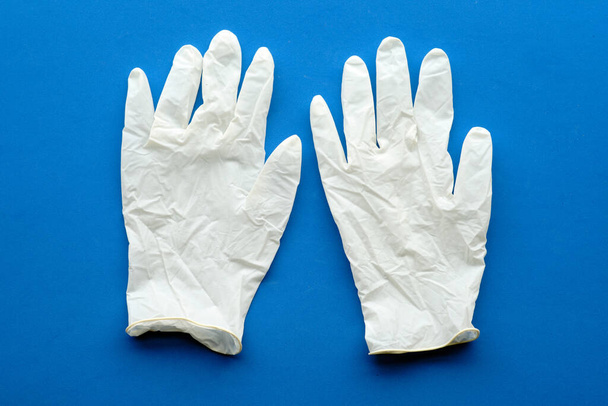 Multipurpose latex gloves with blue background - Photo, Image