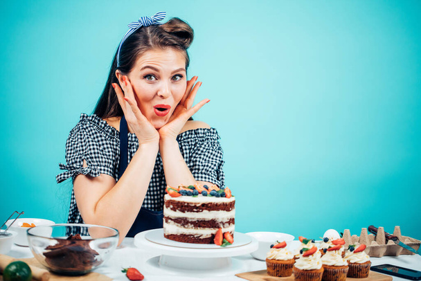 Young natural beautiful caucasian woman showing different emotions tempting with cake - 写真・画像