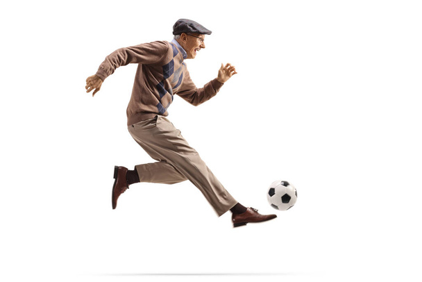 Active elderly man playing football isolated on white background - Foto, immagini