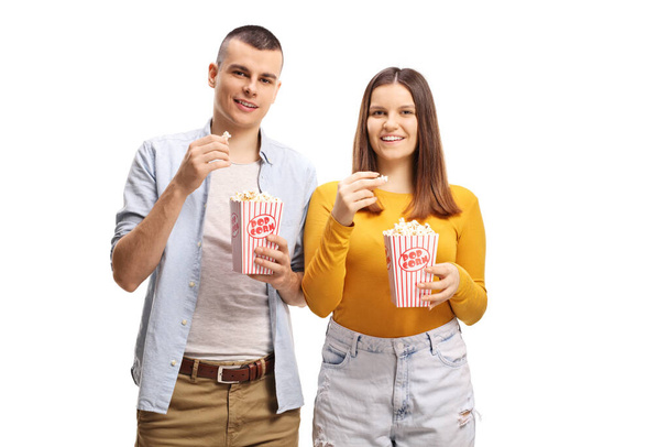 Cheerful young people eating popcorn isolated on white background - Φωτογραφία, εικόνα