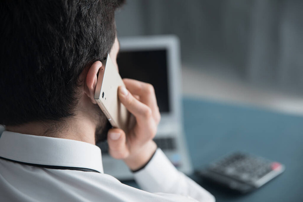 man talking phone working in office des - Foto, Imagen