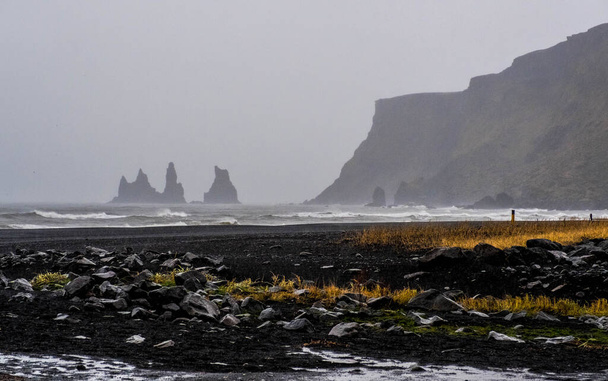 Reynisdrangar rocks from the village of Vik in Iceland - 写真・画像