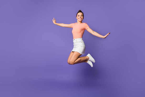 Full length body size view of her she nice attractive lovely pretty cute cheerful cheery girl jumping spending vacation isolated on bright vivid shine vibrant lilac violet purple color background - Fotografie, Obrázek
