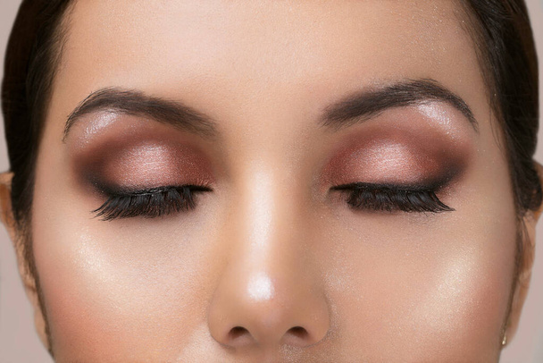 close up of a face with professional makeup and the closed ones open - Photo, Image