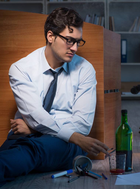 Stressed businessman working overtime in depression - Photo, Image