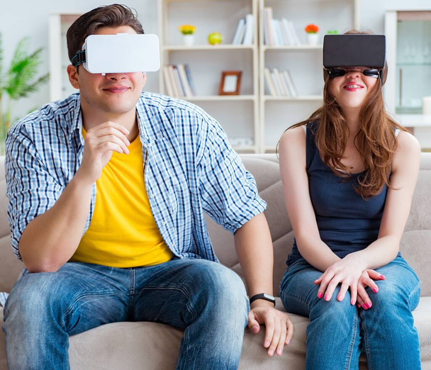 Young family playing games with virtual reality glasses - Photo, Image