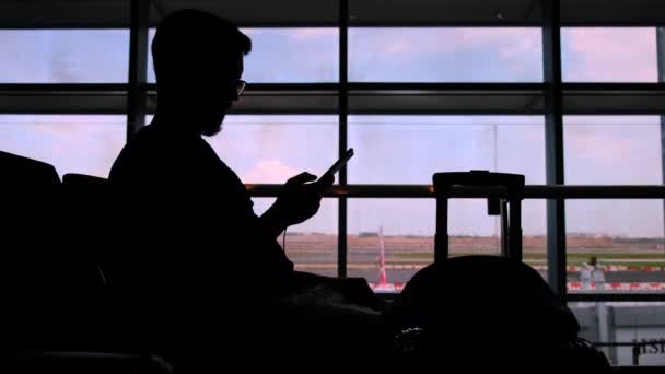 Waiting and killing time with phone when the flight is delayed - Footage, Video