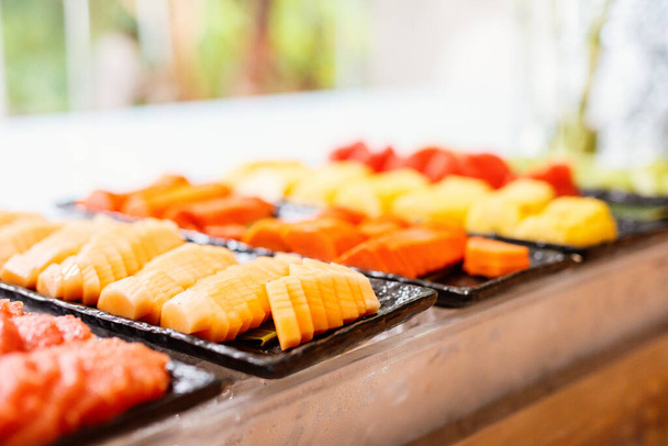 Delicious organic fruits served for breakfast in buffet restaurant - Foto, imagen