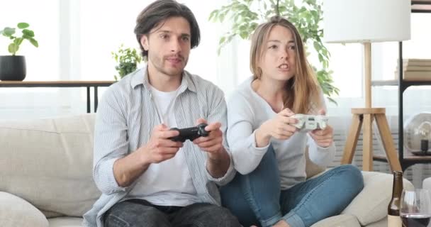 Couple playing video game at home - Video