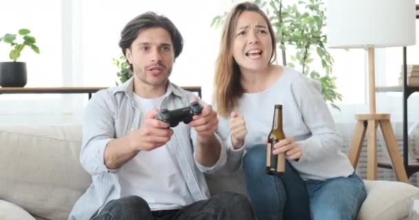 Couple playing video game at home - Footage, Video