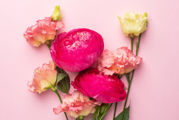Pink and white flower bouquet on pastel background with copyspace top view - Photo, Image
