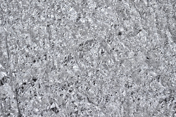 Gray metallic texture of crumpled aluminum foil. - Photo, Image