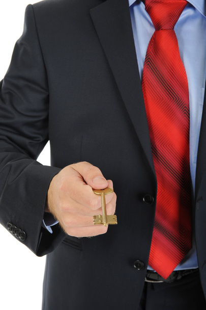 Businessman gives the key - Foto, afbeelding