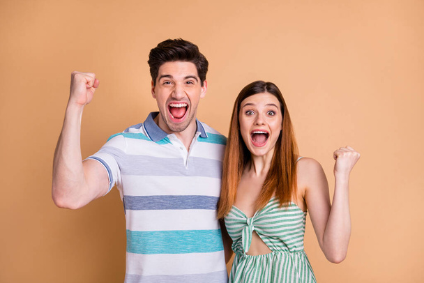 Portrait of his he her she nice attractive lovely crazy cheerful cheery overjoyed glad lucky couple rejoicing great news cool attainment isolated over beige pastel color background - Zdjęcie, obraz