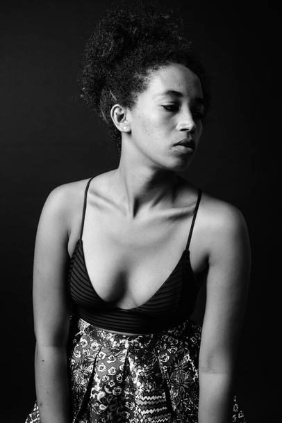 Studio shot of young beautiful African woman with Afro hair in black and white - Φωτογραφία, εικόνα