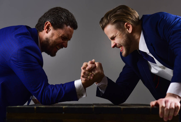 Business conflict concept. Businessmen fighting for leadership. - Photo, image