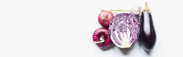 top view of red onion, red cabbage, eggplant and garlic on white background, panoramic shot - Photo, Image