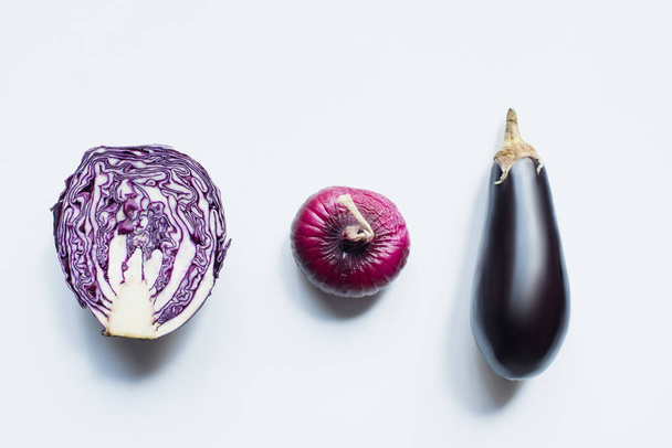 flat lay with red onion, red cabbage, eggplant on white background - Photo, Image