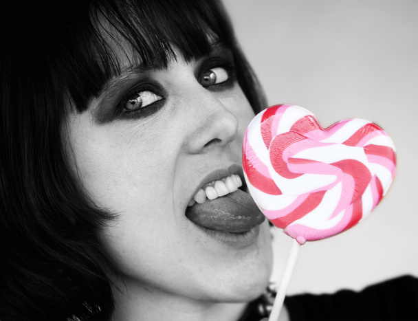 Alternative Girl with a Heart Lollipop - Фото, зображення