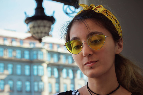 girl portrait hipster trendy street style yellow glasses urban architecture - Photo, Image